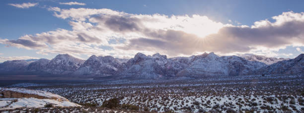 istock Snow on Red rock national park in panorama 810343416