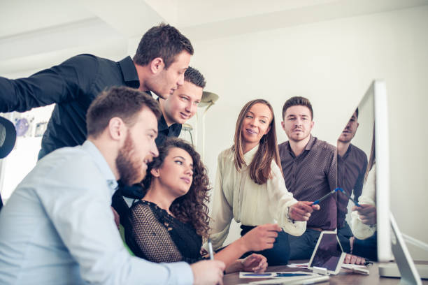 istock Group of Young Coworkers Working on Project in Modern Office 810353130