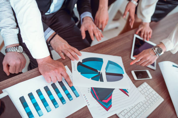 istock Working Business Team Analyzing Charts Reports in the Office 810357558