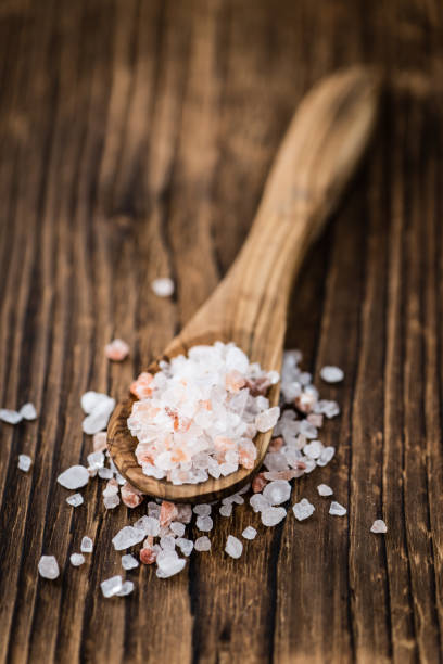 istock Wooden table with Pink Salt (selective focus) 810362366