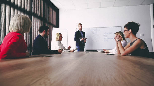 istock Business man presenting new ideas and projects to his team 810364756