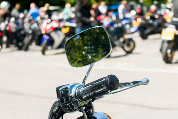 istock Detail on a motorcycle handlebar with mirror 810375362