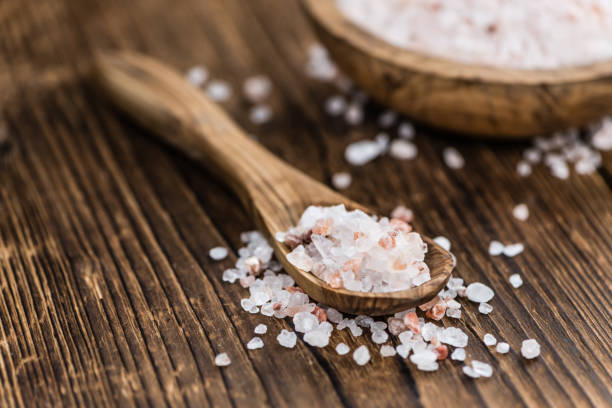 istock Wooden table with Pink Salt (selective focus) 810377646