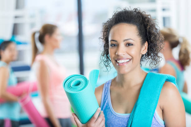 istock Confident woman prepares for yoga class 810386970