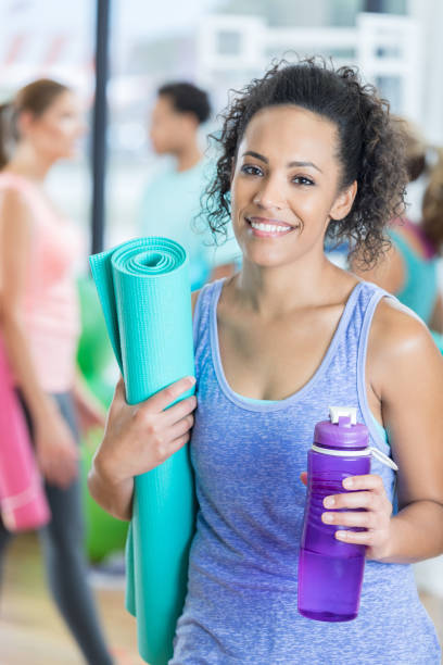 istock Confident woman relaxes after yoga class 810386972