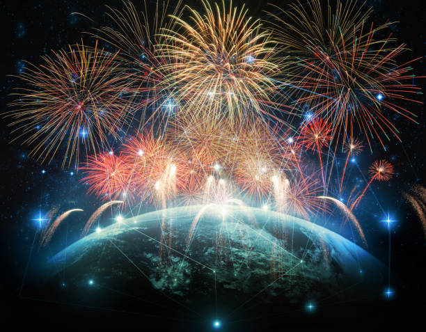 Multicolor Firework Celebration over the Part of earth with network line and point on the star and Milky Way background, Elements of this image furnished by NASA, Independence day concept stock photo