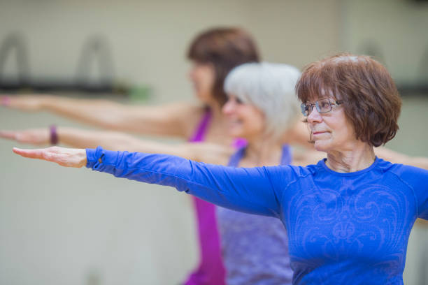 istock Group of Women Exercising Together 810392320