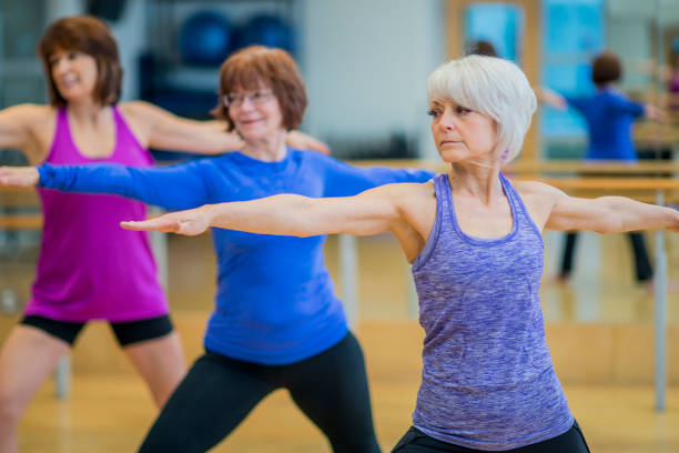 istock Elderly Women Doing Yoga Together 810392372