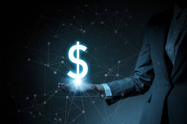 istock dollar symbol floating on woman's hand 810397250