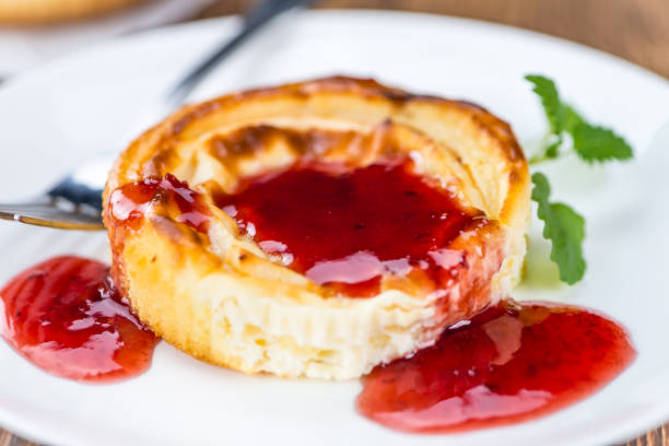 istock Cheesecake with berry Sacue (selective focus) 810402396