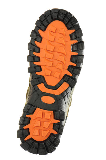 istock Gray brown soles on some white spots on the background 810413806