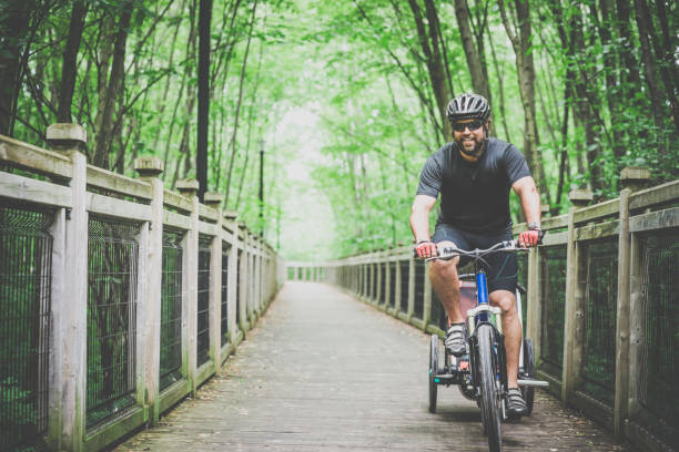 istock Millennial Parents Father Biking with Toddler 810423622