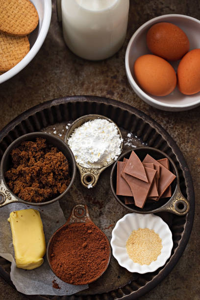 Chocolate pie baking ingredients - eggs, biscuits, chocolate, corn flour, chocolate, cocoa, butter