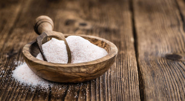 istock Wooden table with Pink Salt (selective focus) 810427016
