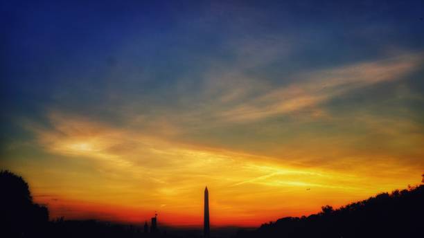 istock Colorful Sunset Sky with Washington Monument in Silhouette 810427058
