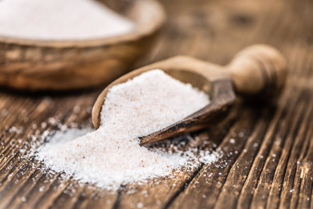 istock Portion of Himalayan Salt on wooden background (selective focus) 810434020