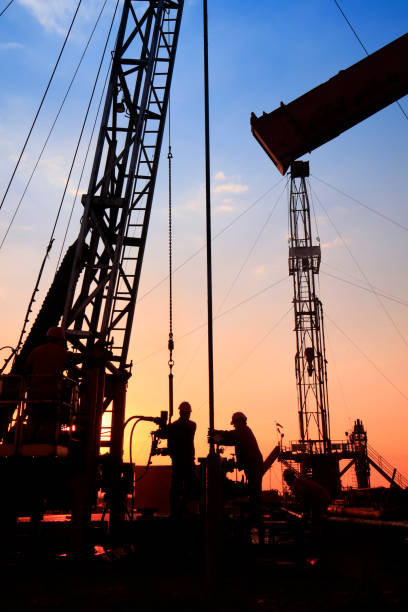 istock oil field, the oil workers are working 810449678