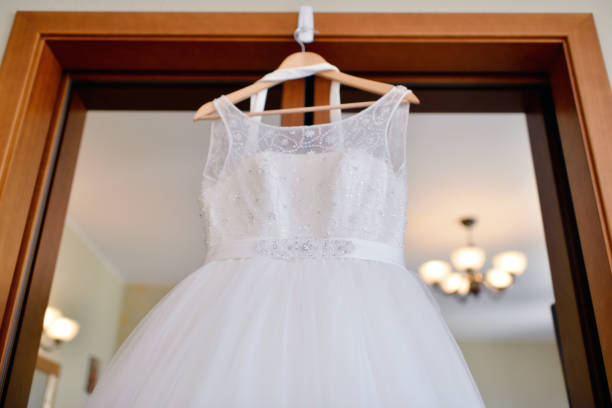 istock Beautiful white wedding dress for bride indoors 810464164