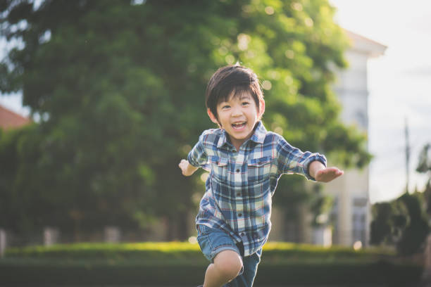 istock Asian child playing in the park 810464334