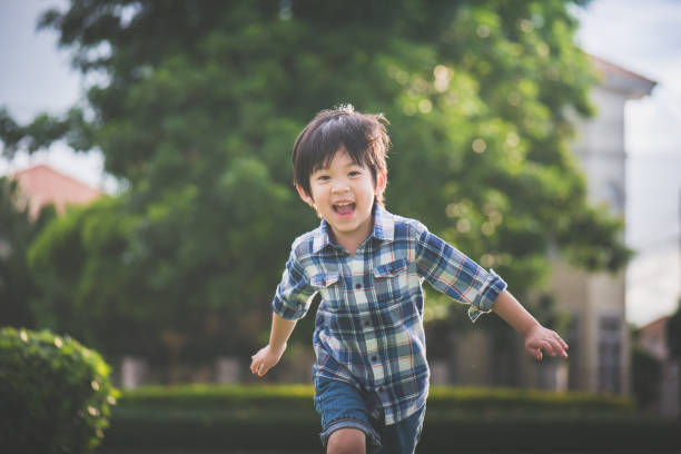 istock Asian child playing in the park 810464342
