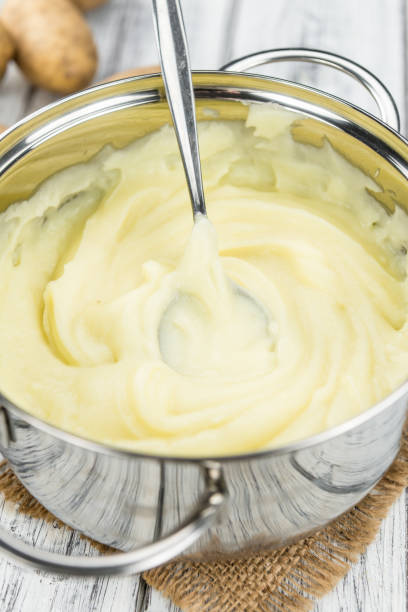istock Mashed Potatoes (selective focus) on vintage wooden background 810469200