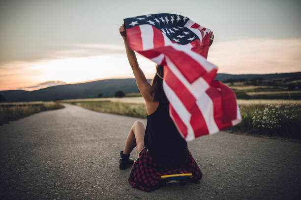 istock Woman skater with US flag 810482992