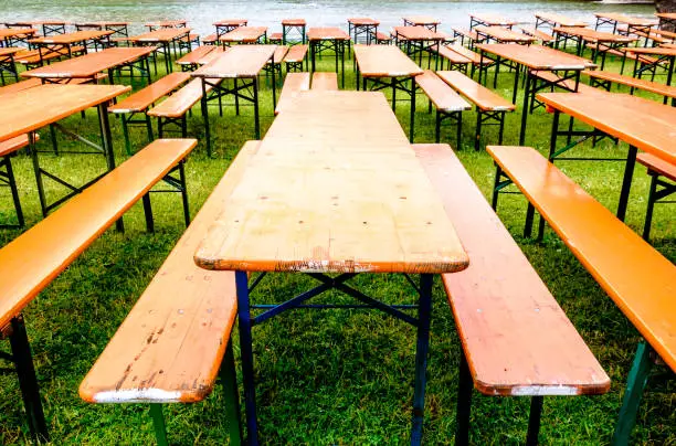 bavarian beergarden - table and benches at a river