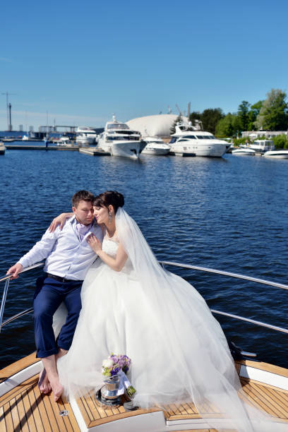 istock Wedding couple is hugging on a yacht 810489276