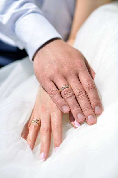istock Wedding couple is holding hands 810491850
