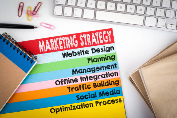 istock Marketing Strategy concept. Office desk with a computer keyboard and color pages 810503210