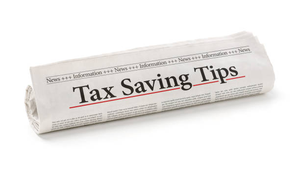 istock Rolled newspaper with the headline Tax saving tips 810511568