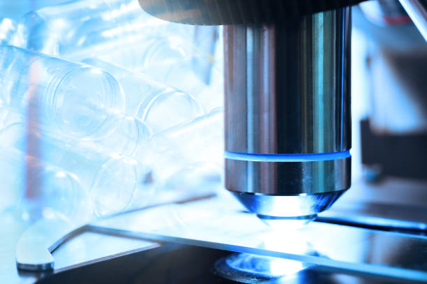 istock close up shot of microscope at the blood laboratory and empty capsules 810511716