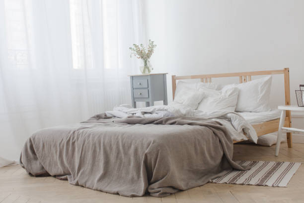 istock Interior of white and gray cozy bedroom 810518354