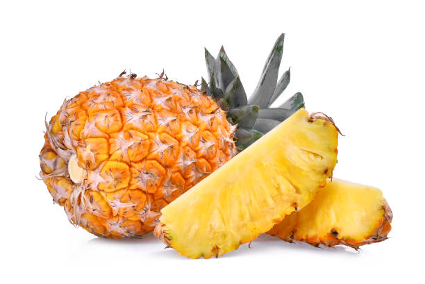 istock ripe whole and half pineapple isolated on white background 810521944