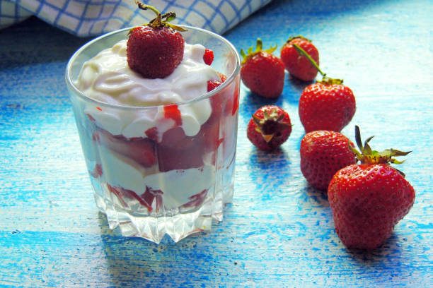 istock sour cream and strawberries in a glass 810524158