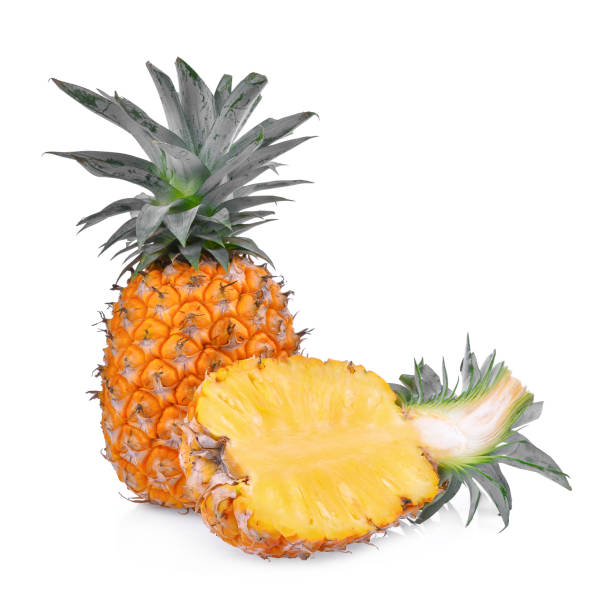 istock ripe whole and half pineapple isolated on white background 810524180