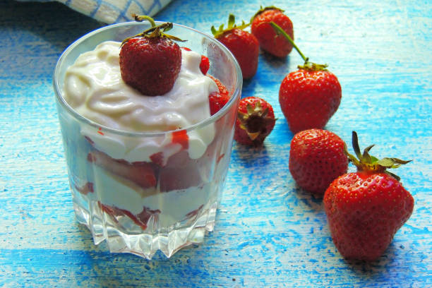 istock sour cream and strawberries in a glass 810524182