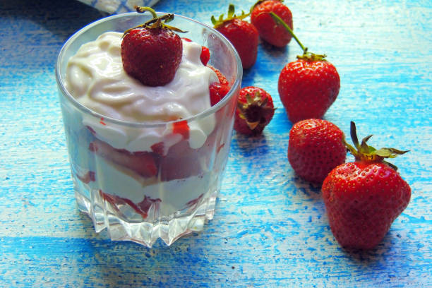 istock sour cream and strawberries in a glass 810524206