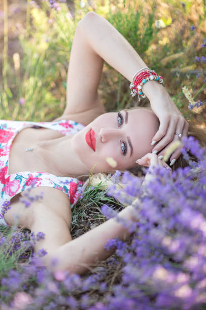 istock Beautiful girl lying on the lavender field 810524730