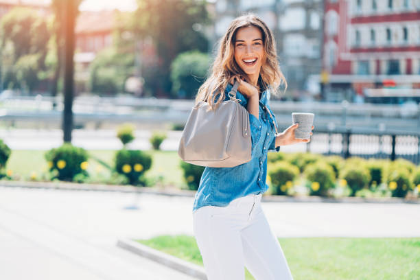 istock Beautiful woman walking at sunshine 810527010