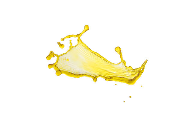 istock flying beautiful engine oil isolated over white background and many drops 810529890