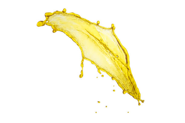 istock flying beautiful engine oil isolated over white background and many drops 810532890