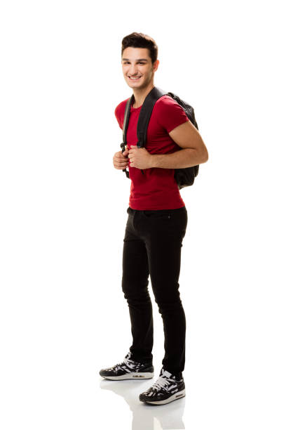 istock University student full length on white background. 810533054