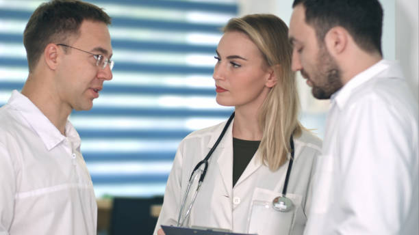 istock Group of doctors having medical discussion 810533272