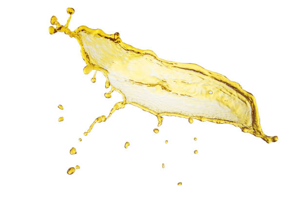 istock flying beautiful engine oil isolated over white background and many drops 810533428