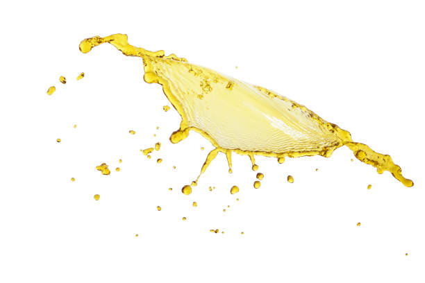 istock flying beautiful engine oil isolated over white background and many drops 810533448