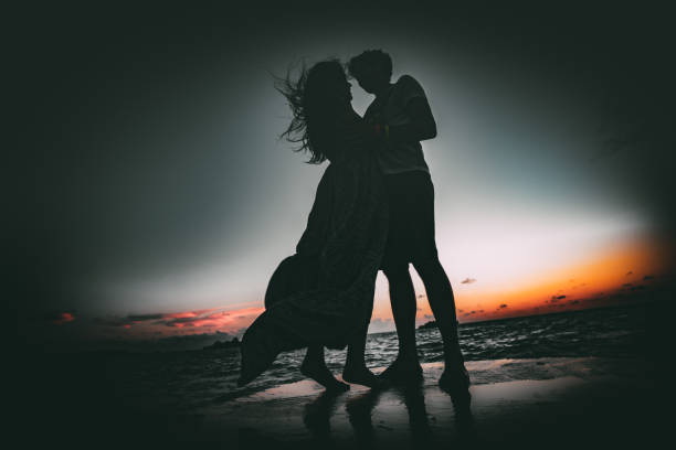 istock Couple on pier in dusk 810535784