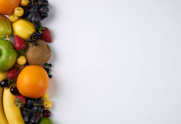 istock Top view of a huge group of fresh vegetables and fruit on white background with copy space. 810536562