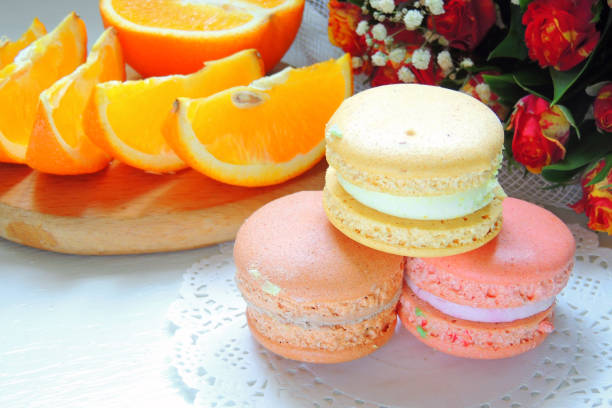 istock Macaroons and flowers roses 810542968