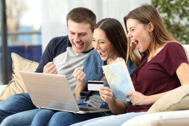 istock Excited friends buying trip on line 810556200